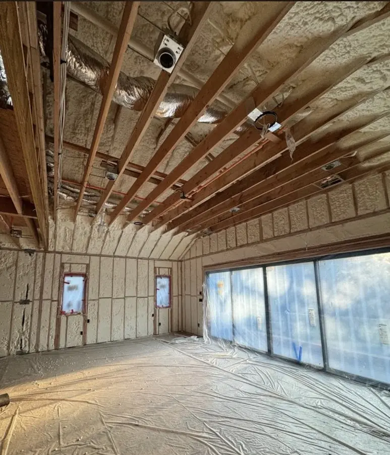 Interior walls and ceiling insulated with spray foam during new construction in Harvey